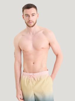 A man wearing bright swim shorts.