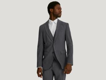 Anzugfarbe Grau – Mann in einem grauen Anzug.