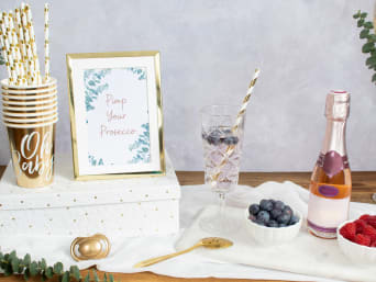 Prosecco bar with fresh berries at a baby shower.