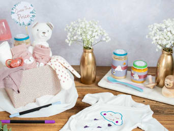 Games for a baby shower: materials & ideas for baby shower games presented on a table. Games for a baby shower: materials & ideas for baby shower games presented on a table.