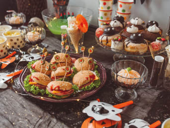 Halloween recipes: Halloween themed food and snacks on a table.