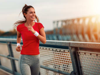 The absolute essentials for runners:  a woman going for a jog in sportswear.