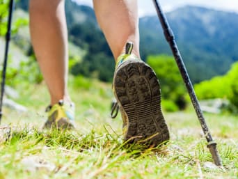 Nordic walking: a close-up of Nordic walking shoes and poles.
