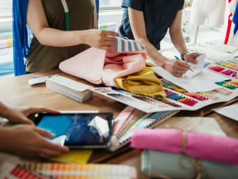 Fashion designers put together colourful fabrics for a collection. Fashion designers put together colourful fabrics for a collection.