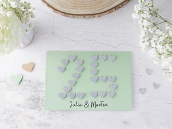 Silver wedding anniversary card: DIY greetings card with a 25 made out of paper hearts.