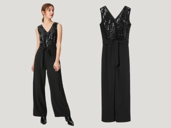 Women’s New Year's Eve outfits: a woman wearing a jumpsuit with sparkling sequins. 