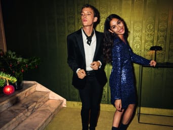Men's and women's New Year's Eve outfits: a festively dressed couple.
