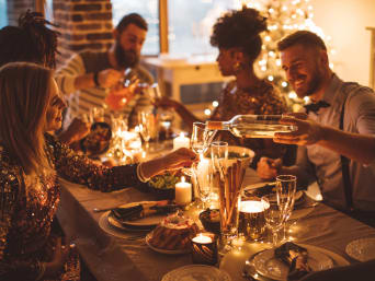 New Year’s Eve ideas: A group of friends at a New Year’s Eve dinner.