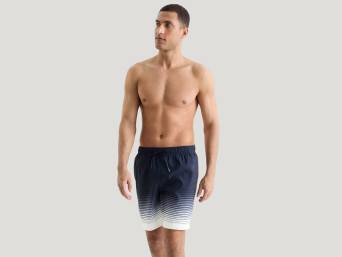 Bermuda shorts – a man wearing knee length Bermuda shorts. Bermuda shorts – a man wearing knee length Bermuda shorts.