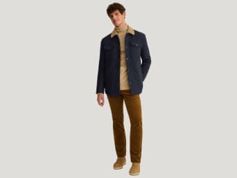 Shackets are a fabulous option as a transitional jacket: a man wearing a shacket.