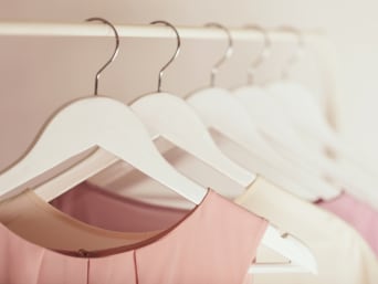 Washing and caring for delicates: hanging up delicate items of clothing on a hanger.
