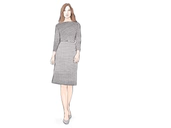 Eine Frau trägt für den Business Casual-Look ein schlicht gemustertes Kleid und geschlossene Schuhe.