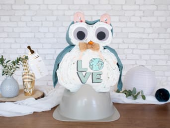 Neutral owl homemade diaper cake in neutral shades.