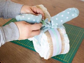 DIY nappy cake - handlebar grips from socks.