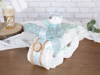 Motorbike nappy cake in neutral colours.
