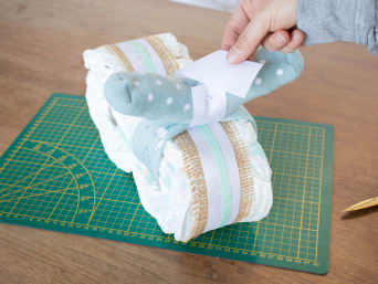 Make your own nappy cake - blend handlebars with decorative tape.
