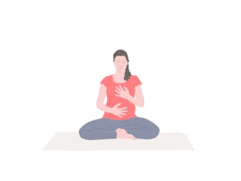 Pregnancy yoga - woman performs a short mediation.