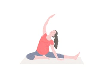 Pregnancy yoga - pregnant woman performs a side stretch.