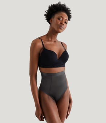 Waist shapewear: a woman wearing a shapewear thong.