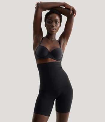 Shapewear for tummy, thighs and buttocks: a woman wearing shaping trousers.