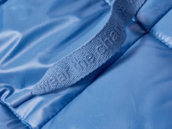 A close-up of an item of clothing made out of synthetic fibres.