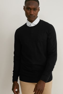 white shirt with black jumper over