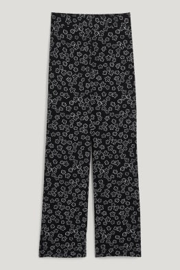 CLOCKHOUSE - spodnie materiałowe - wysoki stan - szerokie nogawki - w kwiatki