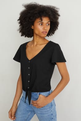 T-shirt met knoop in de stof