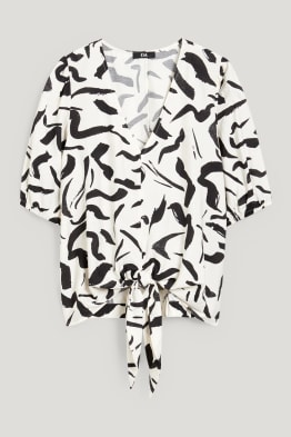 Blouse met knoop in de stof