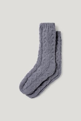 Knitted socks with cable pattern