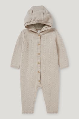 Knitted baby jumpsuit - cable knit pattern