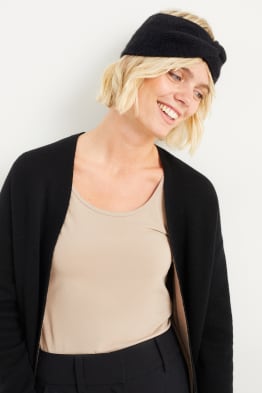 Fascetta scaldafronte in maglia con nodo