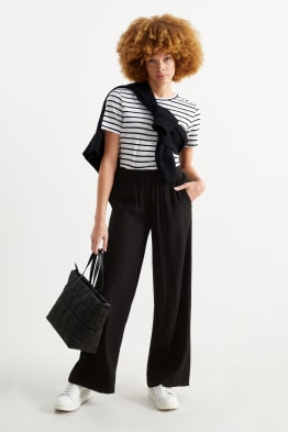 Pantaloni che si aprono di lato on sale