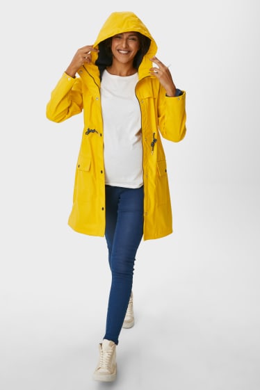 Femmes - Veste de pluie de grossesse à capuche avec empiècement porte-bébé - doublée - jaune