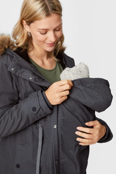 Femmes - Parka de grossesse à capuche, garniture en fausse fourrure et empiècement porte-bébé amovible. - gris foncé
