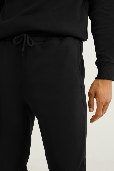Mężczyźni - Spodnie dresowe - czarny