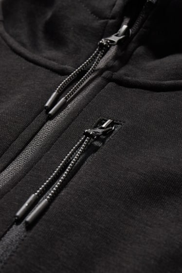 Hommes - Veste en molleton dotée d’une capuche - noir