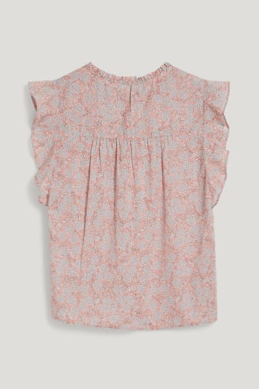 Dona - Brusa - de flors - rosa fosc
