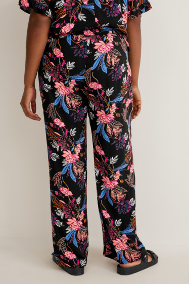 Femmes - Pantalon en toile - mid waist - jambe évasée - à fleurs - noir