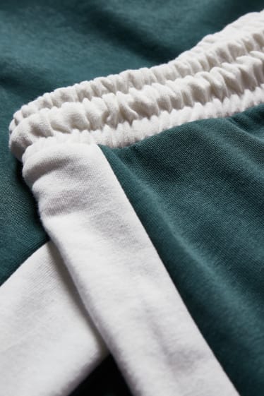 Exclusivo online - CLOCKHOUSE - pantalón de deporte - verde oscuro-jaspeado