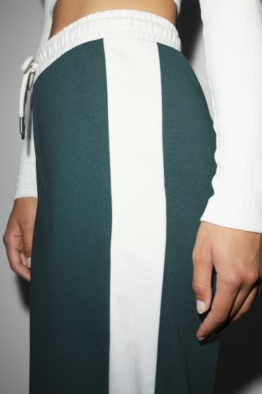 Exclusivo online - CLOCKHOUSE - pantalón de deporte - verde oscuro-jaspeado
