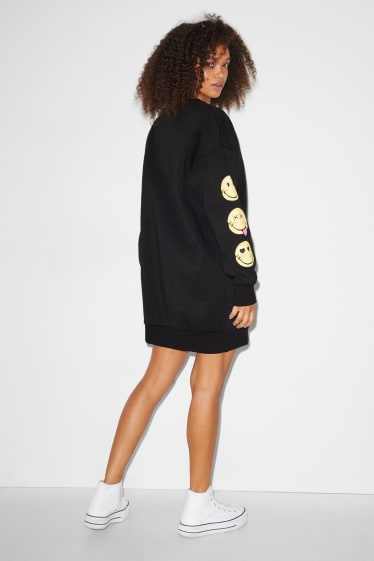 Exclu web - CLOCKHOUSE - robe en molleton - SmileyWorld® - noir