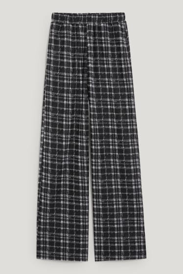 Exclusiv online - CLOCKHOUSE - pantaloni de stofă - talie medie - palazzo - în carouri - negru / alb
