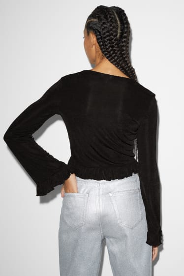 Exclusiu online - CLOCKHOUSE - samarreta crop de màniga llarga - negre