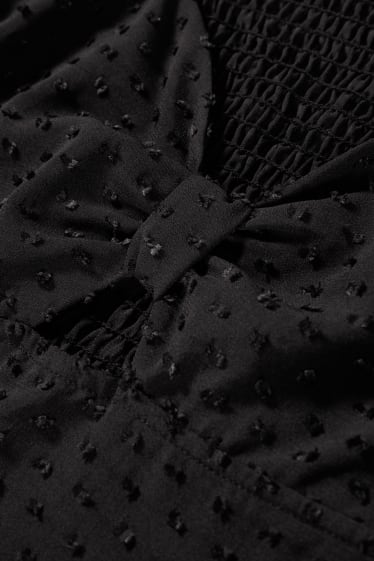 Esclusiva online - CLOCKHOUSE - blusa taglio corto - nero