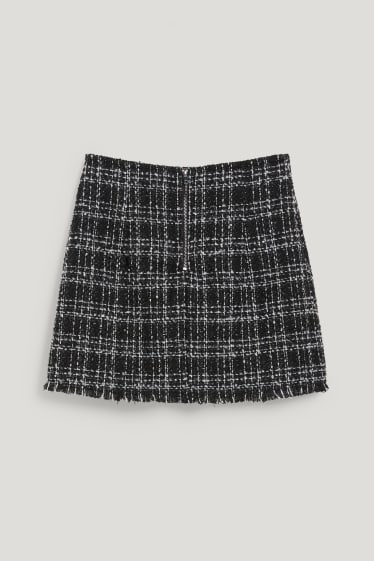 Femmes - Mini-jupe en bouclé - à carreaux - noir / blanc