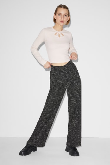 Exclusivo online - CLOCKHOUSE - pantalón de punto - loose fit - negro jaspeado