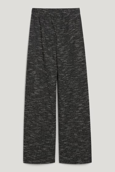 Exkluzivní online - CLOCKHOUSE - žerzejové kalhoty - loose fit - černá-žíhaná