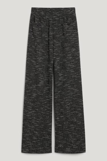 Exkluzivní online - CLOCKHOUSE - žerzejové kalhoty - loose fit - černá-žíhaná