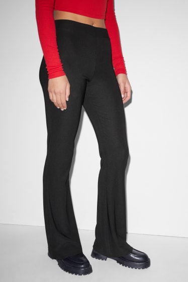 Clockhouse Girls - CLOCKHOUSE - jersey trousers - flared - black